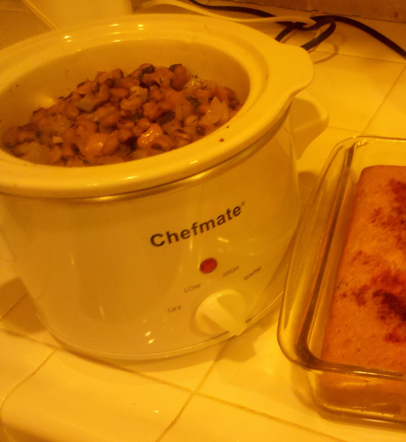 Warming my 2011 Black-eyed peas in the crock pot, with paprika dusted cornbread on the side